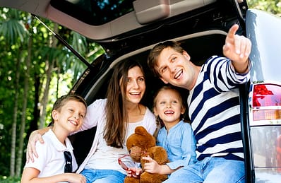family in back car